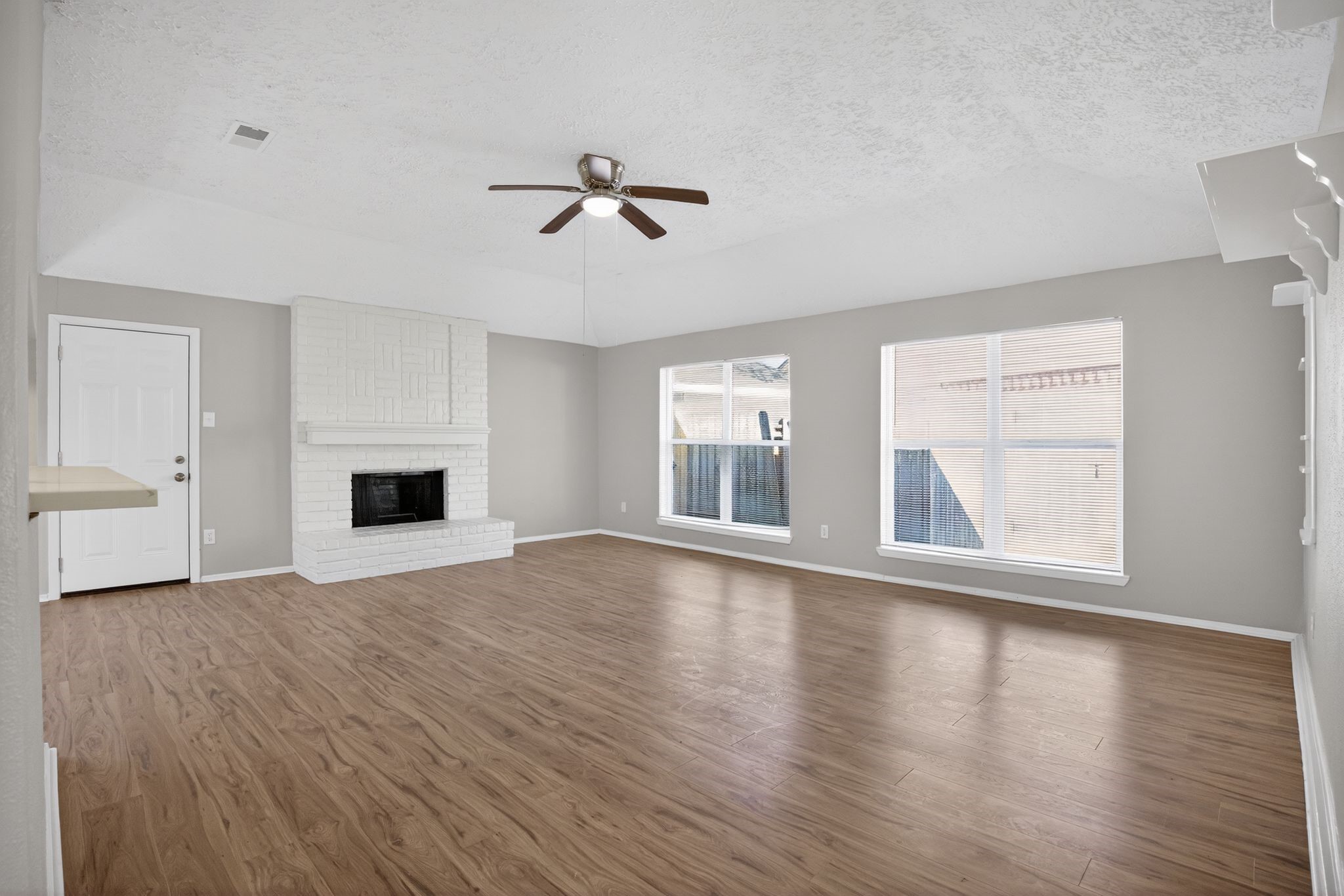 7311 Postwick Court Houston, TX 77095 - Photo 5 of 36 a view of empty room with wooden floor and fan