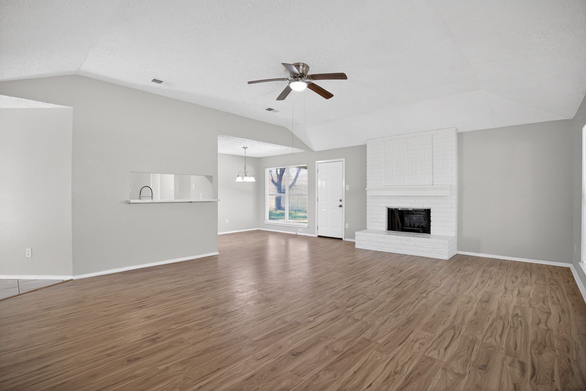 7311 Postwick Court Houston, TX 77095 - Photo 6 of 36 a view of empty room with wooden floor and fan