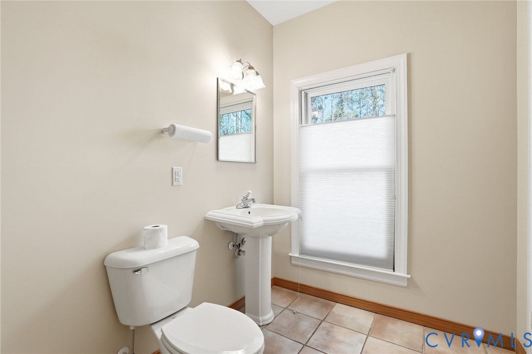 14430 Overlook Ridge Lane Beaverdam, VA 23015 - Photo 49 of 71 a bathroom with a toilet sink and mirror