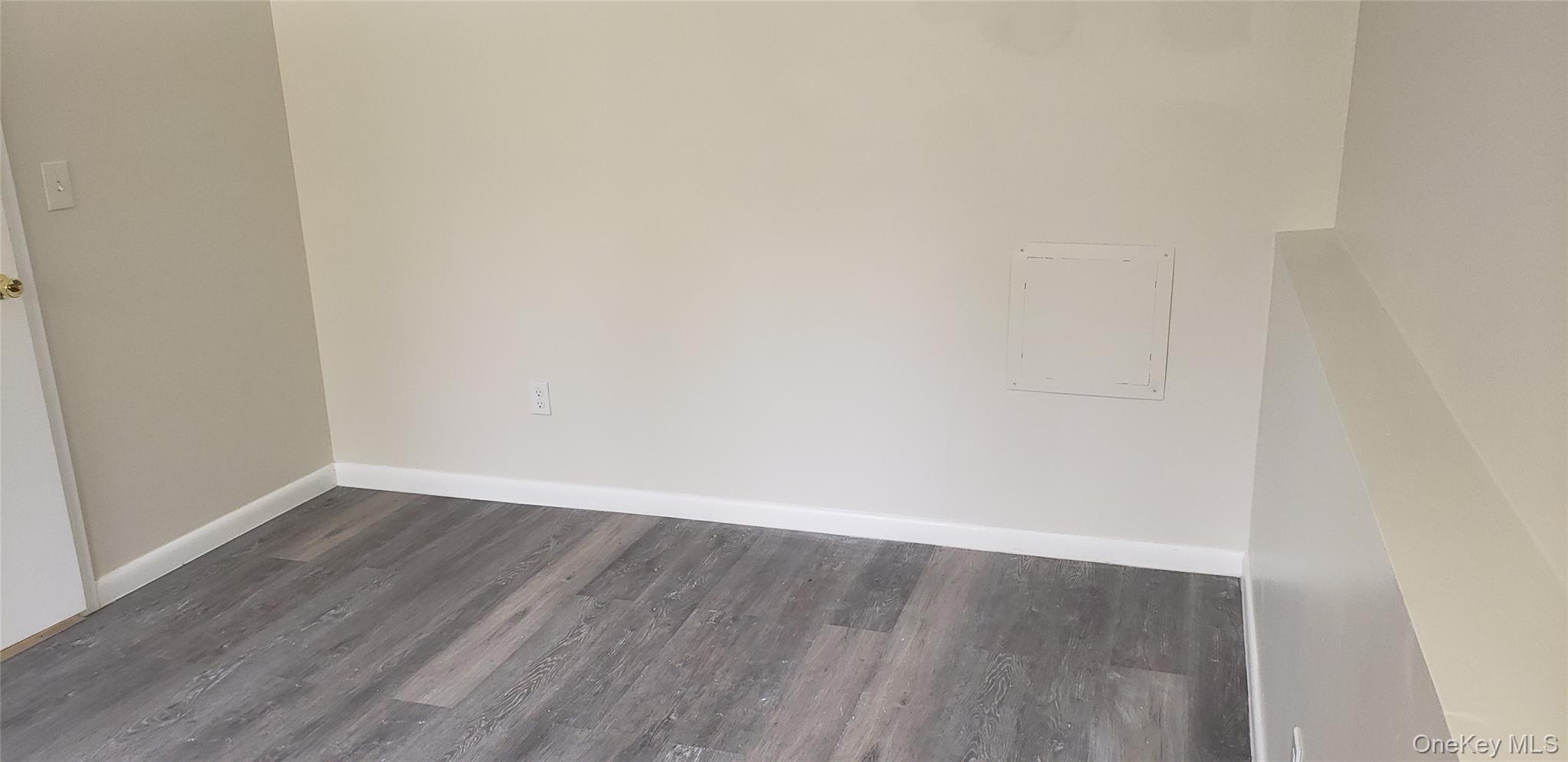 42 Upper Ferndale Road, Unit B Liberty, NY 12754 - Photo 13 of 18 Empty room with dark wood-style flooring and baseboards