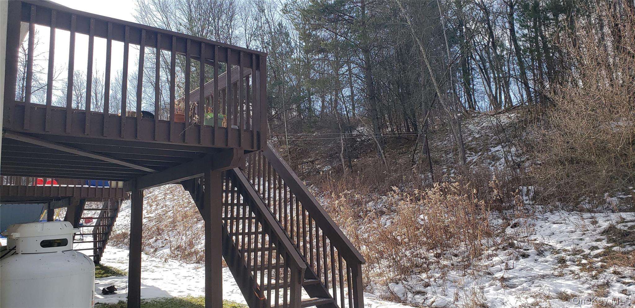 42 Upper Ferndale Road, Unit B Liberty, NY 12754 - Photo 18 of 18 Snow covered deck with stairs