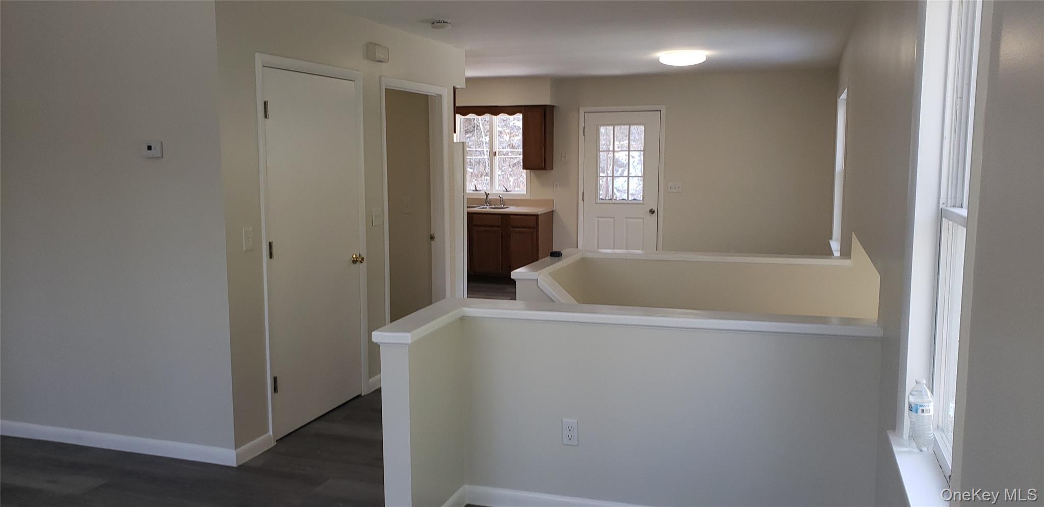 42 Upper Ferndale Road, Unit B Liberty, NY 12754 - Photo 5 of 18 Laundry area with dark wood-style floors and baseboards