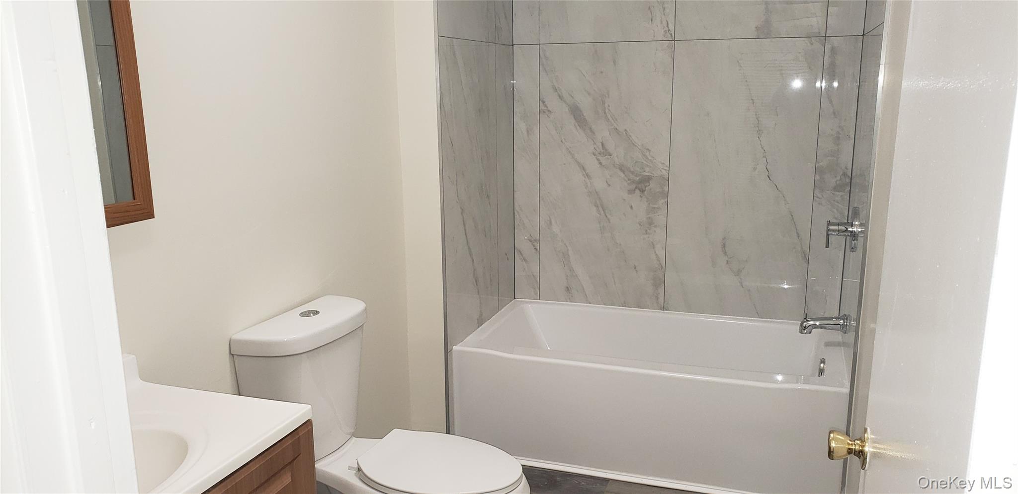 42 Upper Ferndale Road, Unit B Liberty, NY 12754 - Photo 8 of 18 Bathroom featuring vanity and bathtub / shower combination