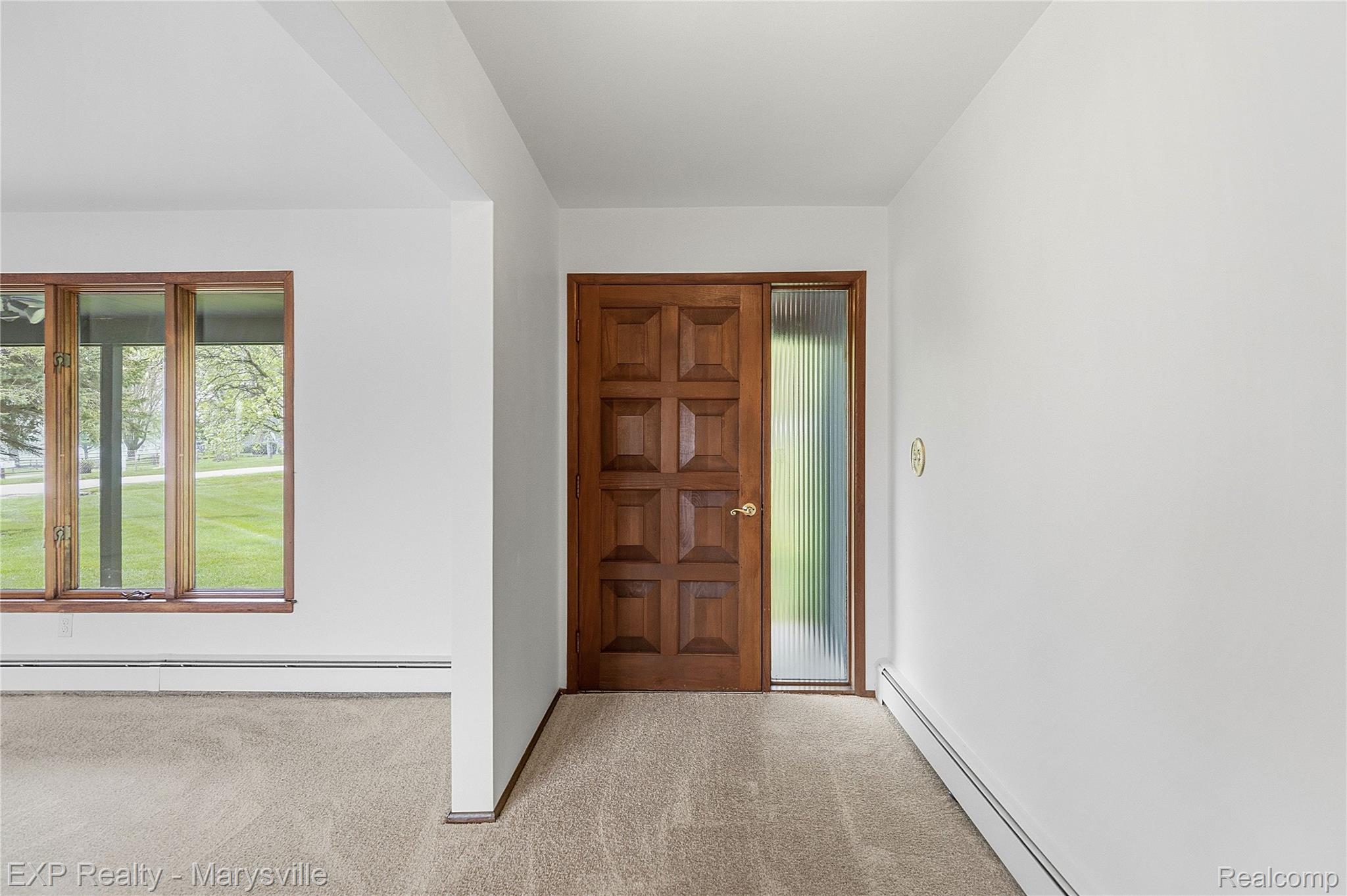 3345 Beach Road Port Huron, MI 48060 - Photo 27 of 89 Foyer entrance with baseboard heating and light colored carpet
