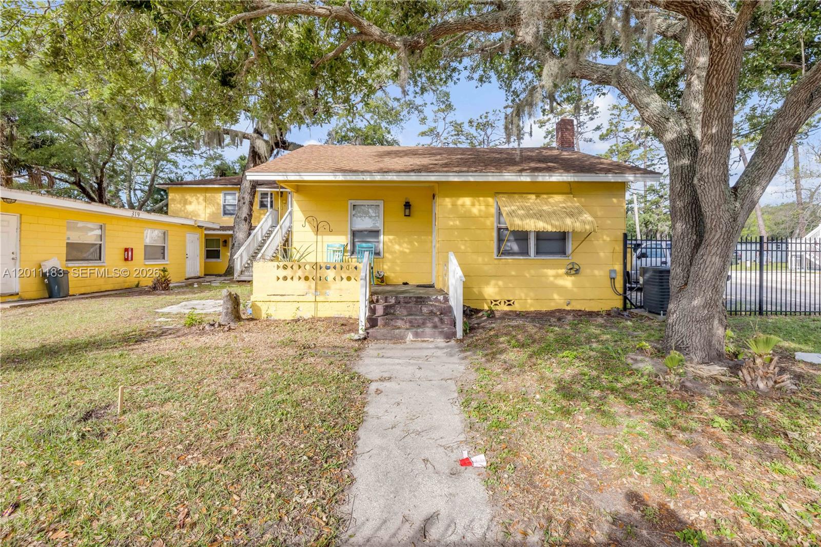 1208 South Ridgewood Avenue Daytona Beach, FL 32114 - Photo 10 of 27 a view of a house with a yard
