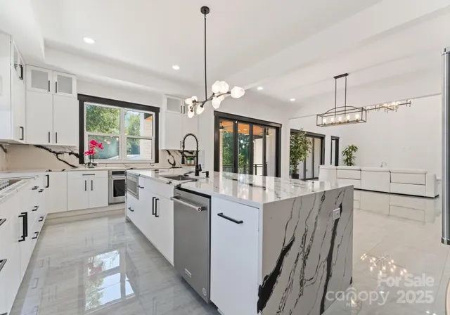 a kitchen with counter top space appliances and windows
