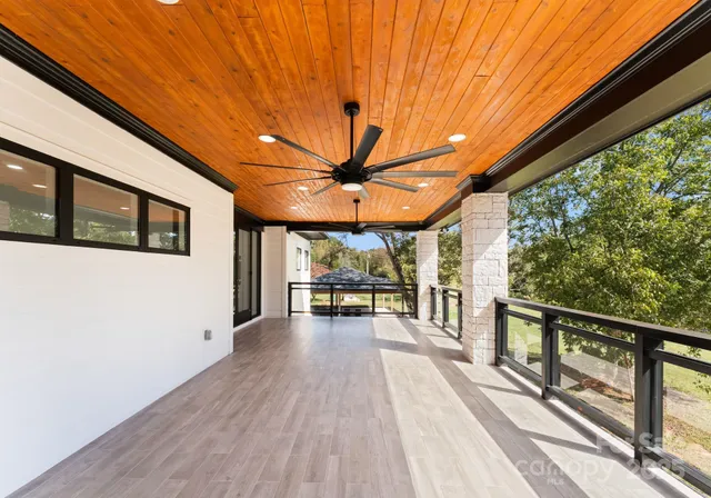 a view of two chairs in the balcony