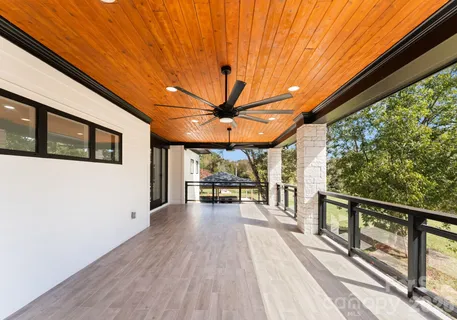 a view of a patio with wooden floor