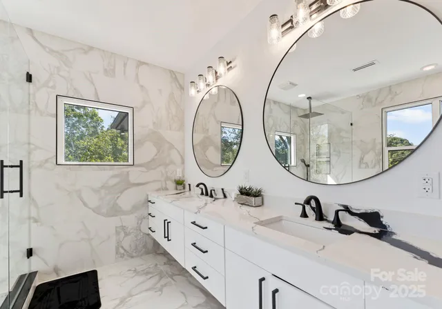 a bathroom with a sink double vanity and a mirror