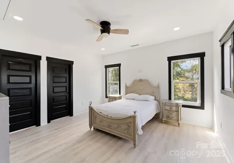 a bedroom with a bed and a closet