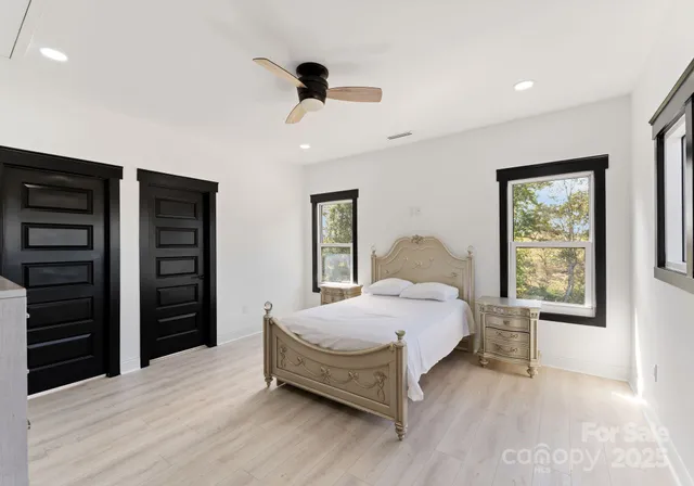 a bedroom with a bed and a closet