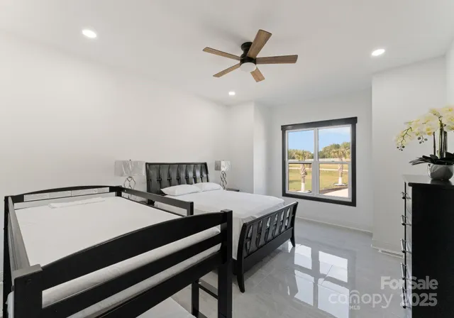 a bedroom with a bed and a tv