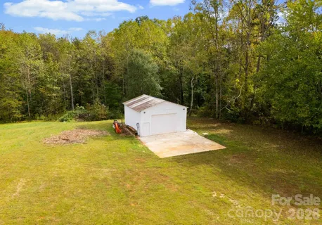 a view of a swimming pool with a yard