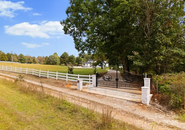 a view of a swimming pool with an outdoor seating and a yard