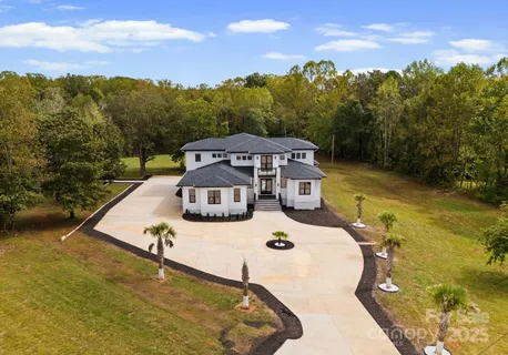 a view of a swimming pool with a yard