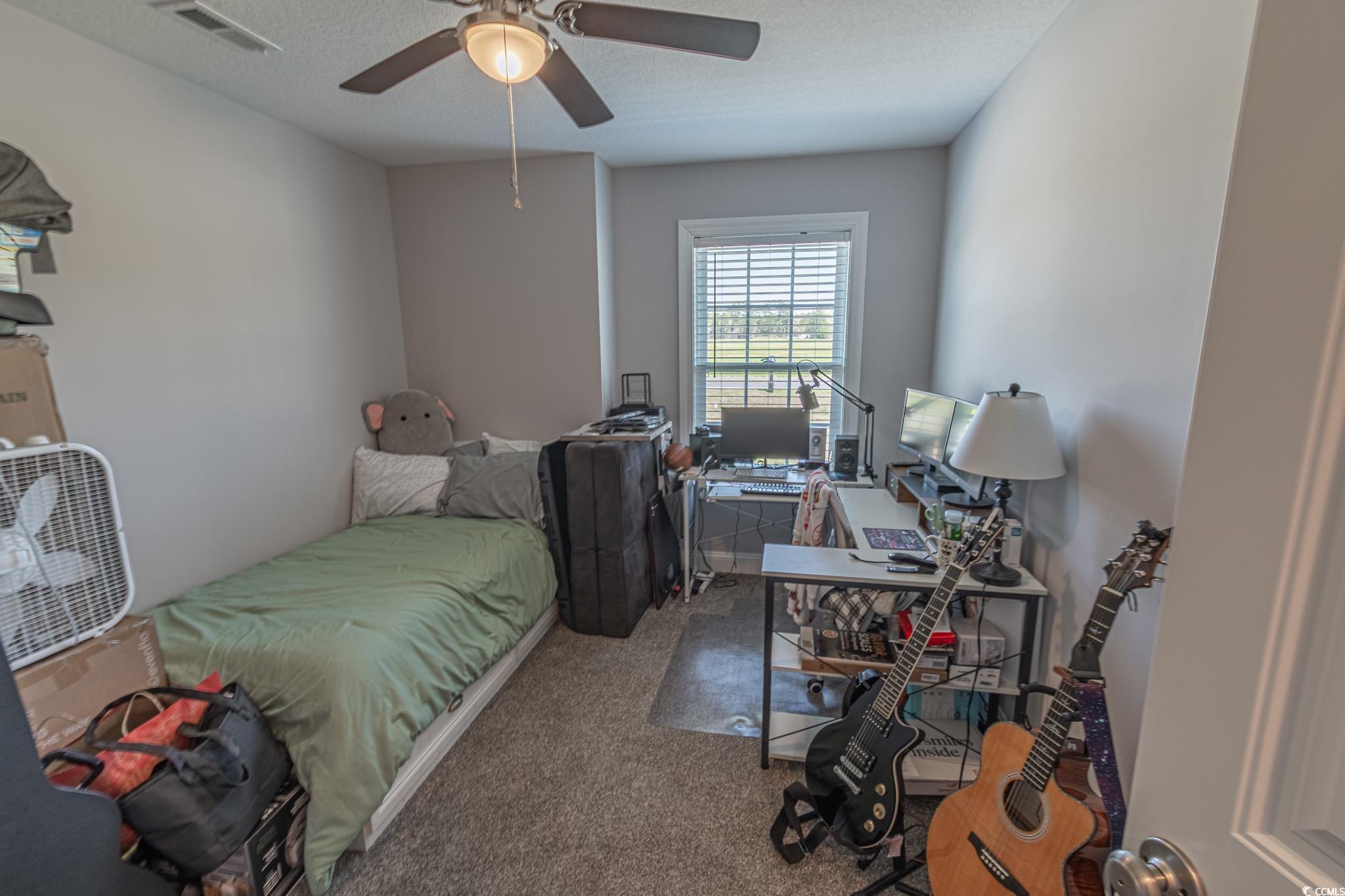 3016 Wise Road Conway, SC 29526 - Photo 13 of 19 Bedroom featuring carpet floors, a textured ceilin