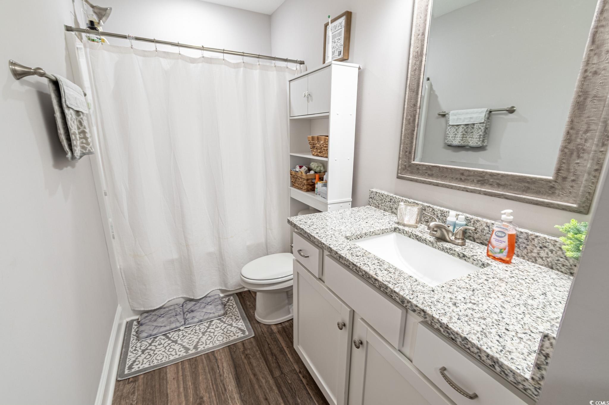 3016 Wise Road Conway, SC 29526 - Photo 14 of 19 Full bath with a shower with curtain, toilet, wood
