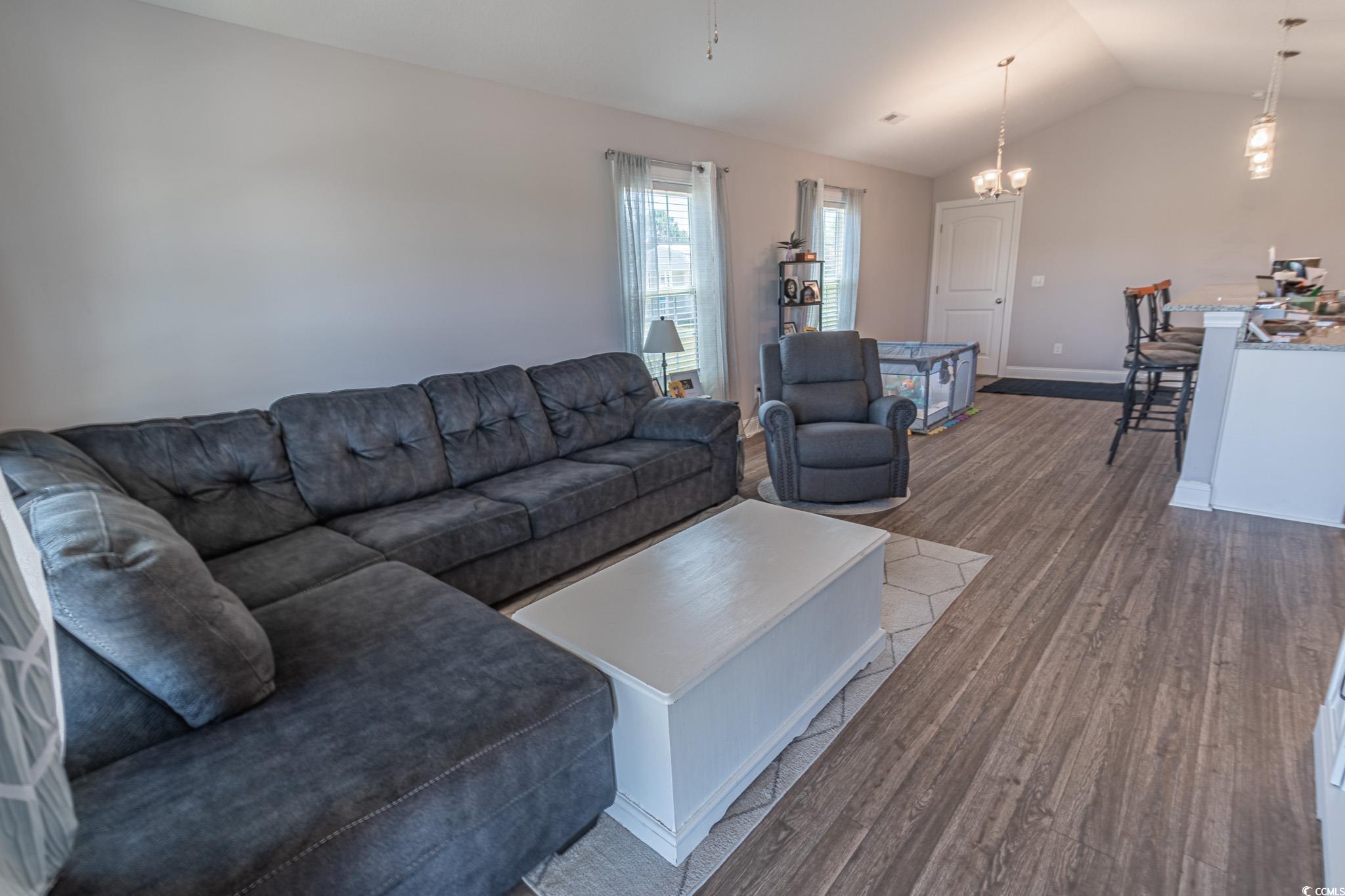 3016 Wise Road Conway, SC 29526 - Photo 5 of 19 Living area featuring baseboards, lofted ceiling,