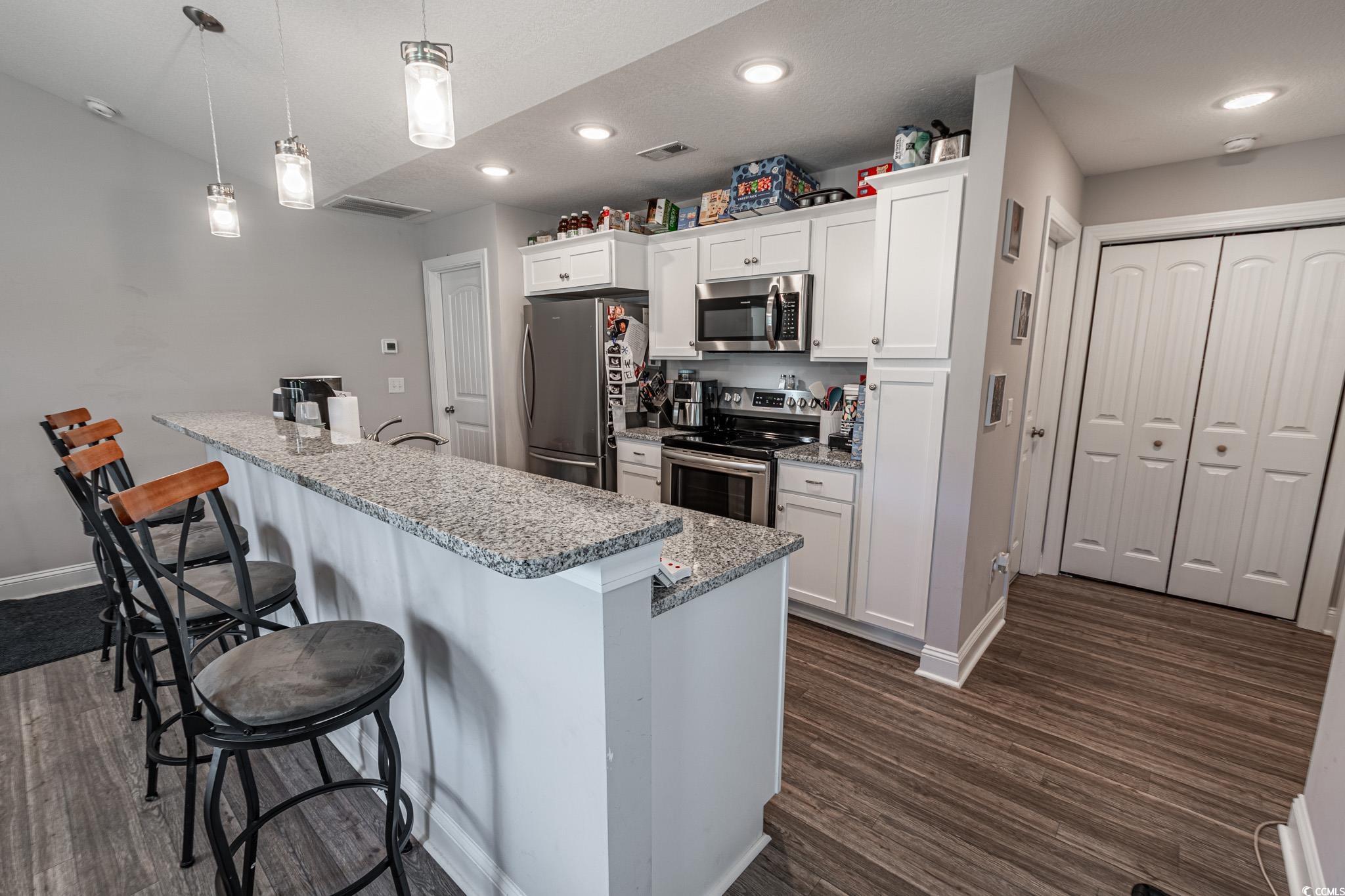 3016 Wise Road Conway, SC 29526 - Photo 8 of 19 Kitchen featuring a kitchen bar, appliances with s