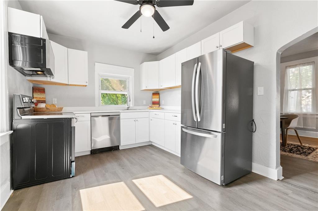145 Georgetown Avenue Pittsburgh, PA 15229 - Photo 12 of 22 a kitchen with stainless steel appliances a refrigerator sink and cabinets