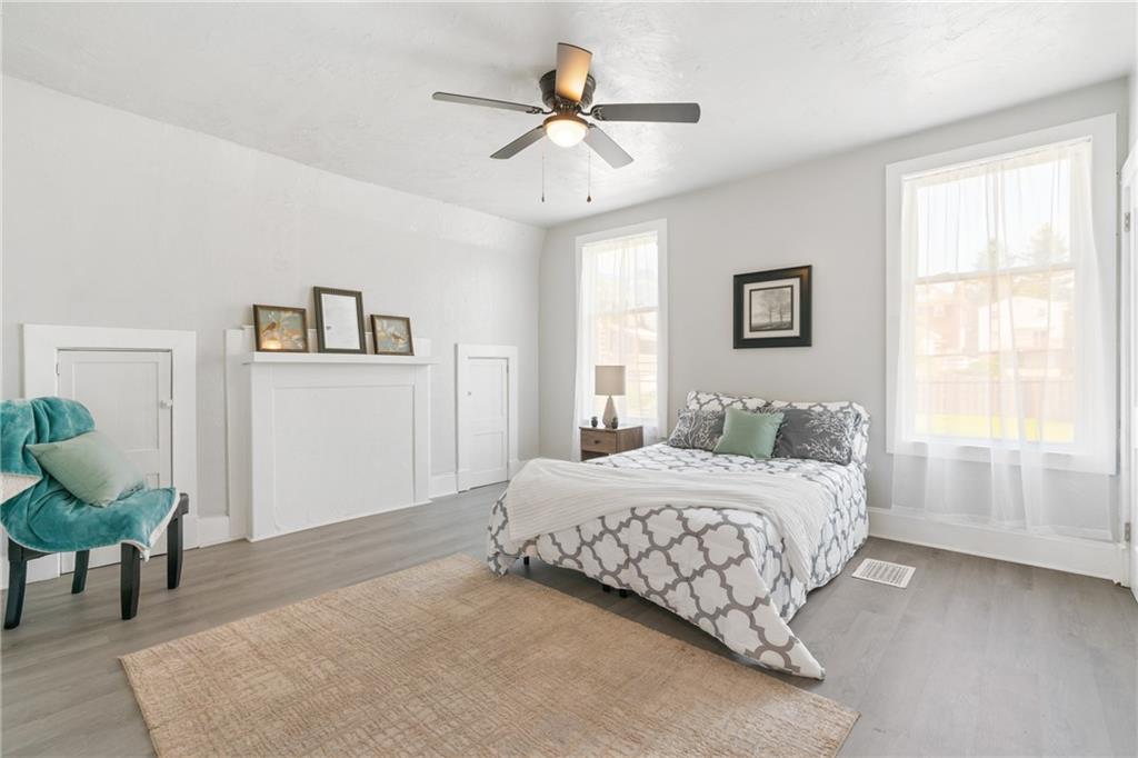 145 Georgetown Avenue Pittsburgh, PA 15229 - Photo 16 of 22 a bedroom with a bed and a chandelier