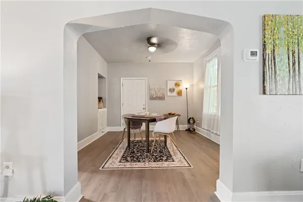 a view of dining room with a table and chairs