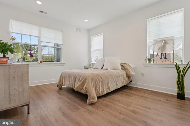 a bedroom with a bed and closet