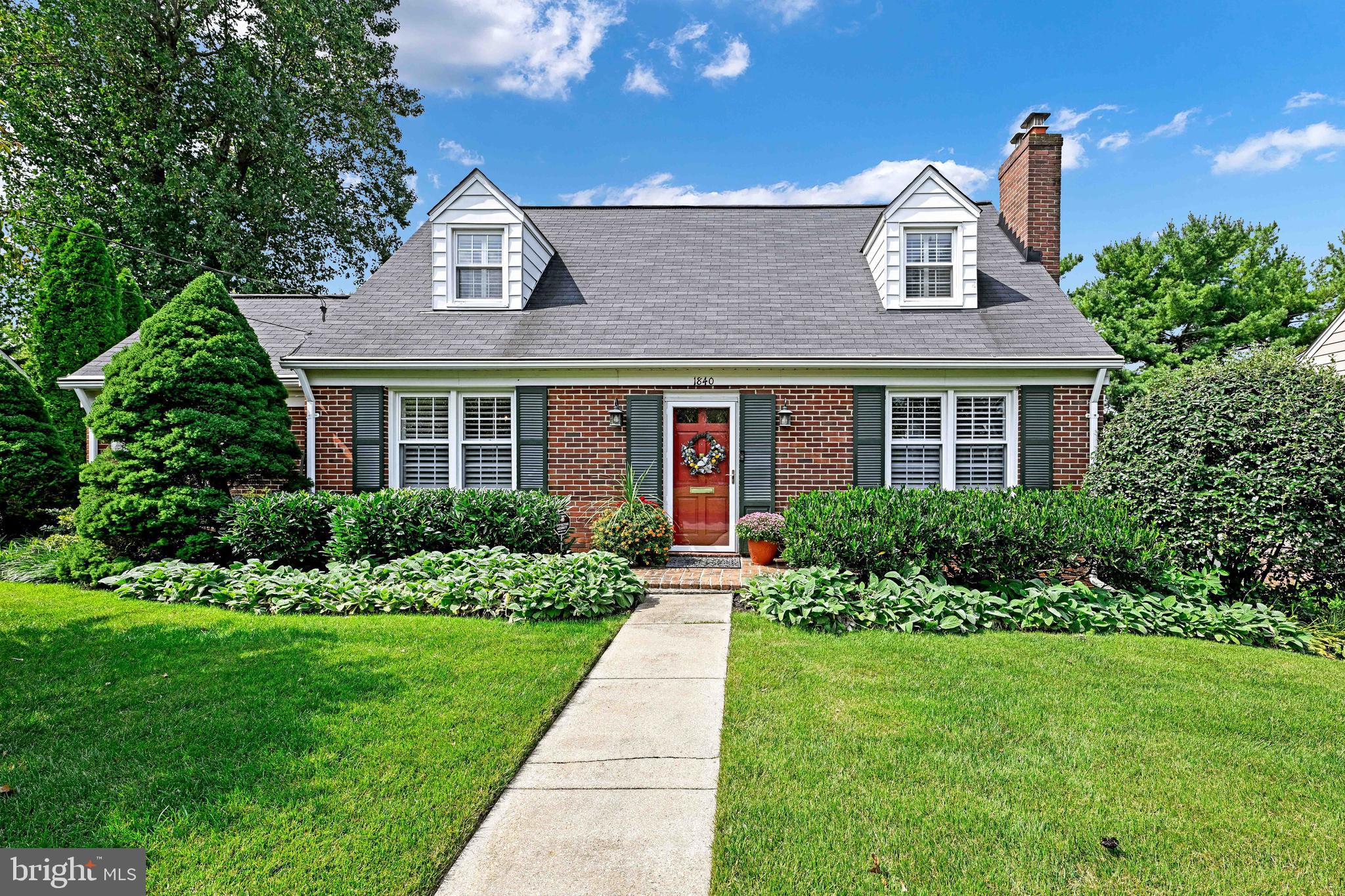 Quaint Brick Cape Cod Style Home