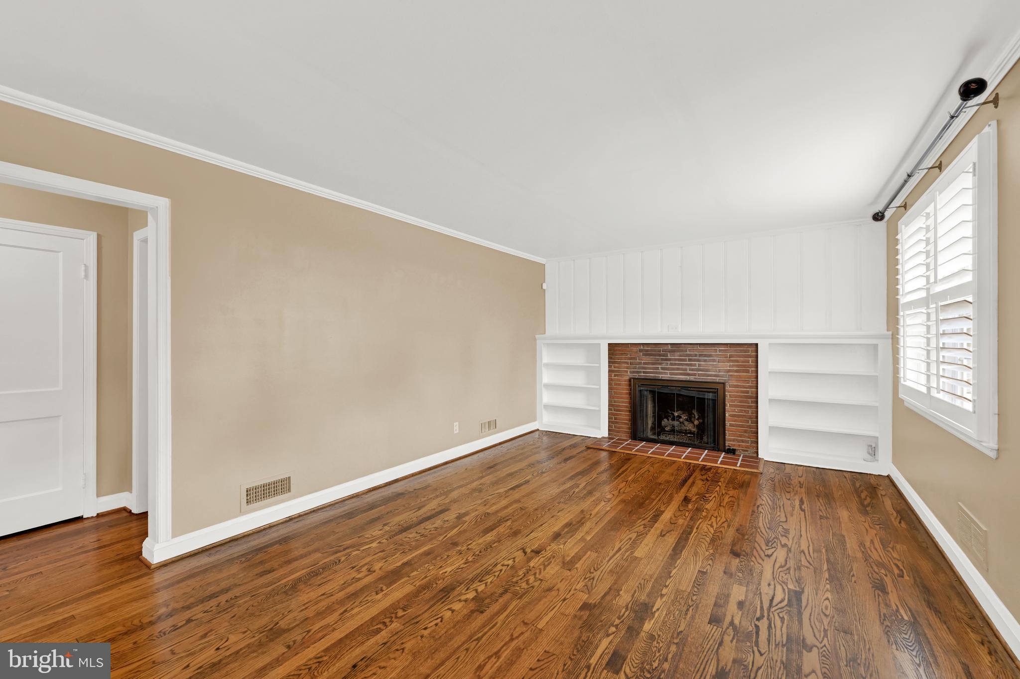 1840 Locust Ridge Road Lutherville-Timonium, MD 21093 - Photo 16 of 39 Living Room with Gas Log Insert and glass doors