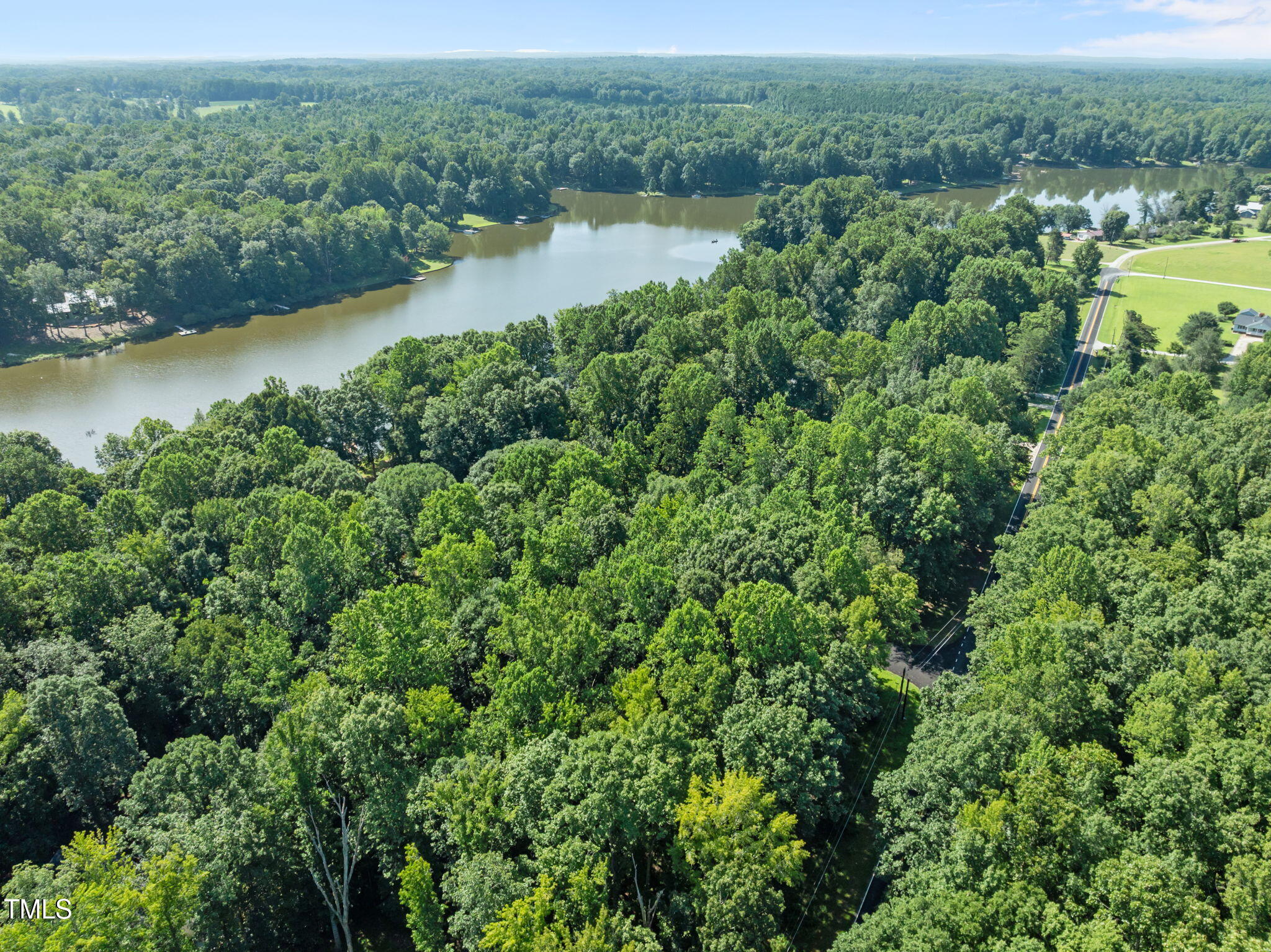 605 Canotage Court Cedar Grove, NC 27231 - Photo 7 of 17 an aerial view of a houses with a lake view