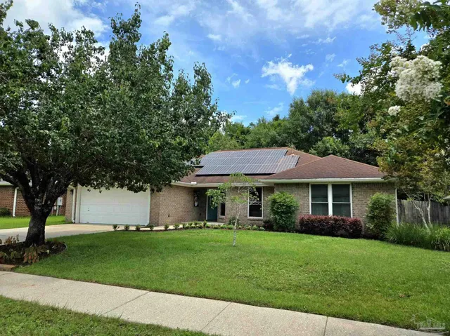 a living room with a couch and a stove top oven