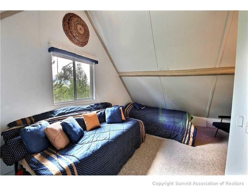 123 J Road Silverthorne, CO 80498 - Photo 11 of 17 a living room with furniture and a window