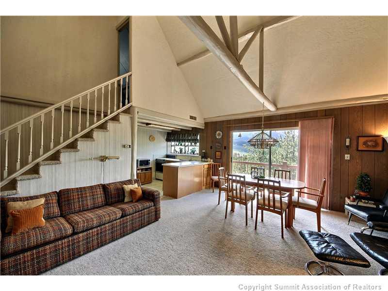 123 J Road Silverthorne, CO 80498 - Photo 4 of 17 a living room with furniture a table and chairs