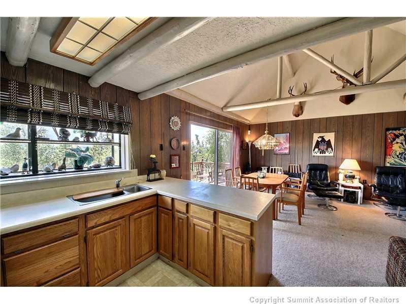 123 J Road Silverthorne, CO 80498 - Photo 6 of 17 a kitchen with a sink appliances and cabinets