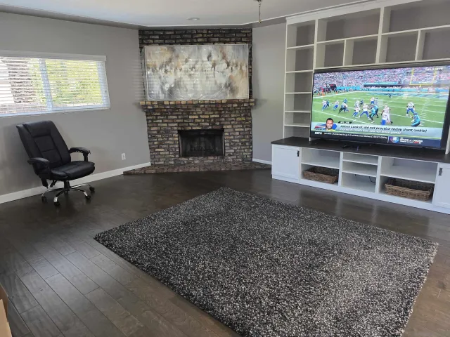 a living room with furniture and a fireplace