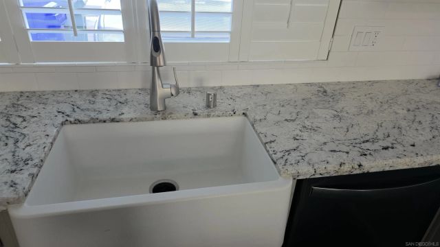 a kitchen with a stove and cabinets