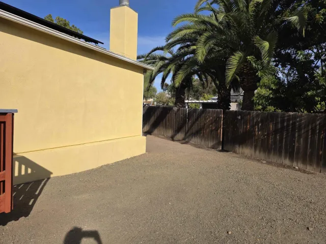 a utility room with wooden floor washer and dryer