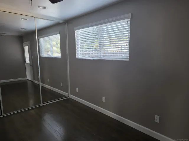 a backyard of a house with wooden fence