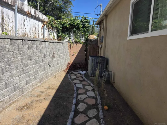 a room with water heater and wooden floor