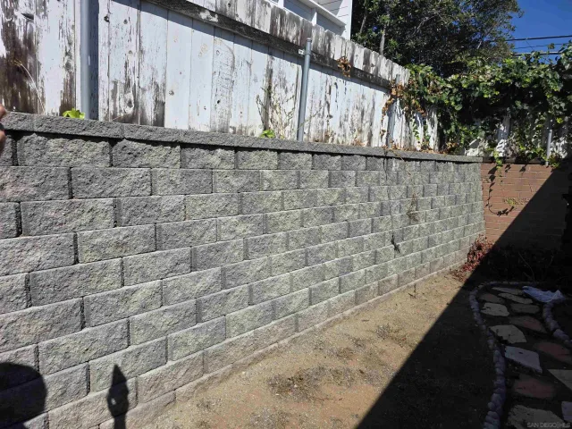 a view of staircase with wooden floor and chair