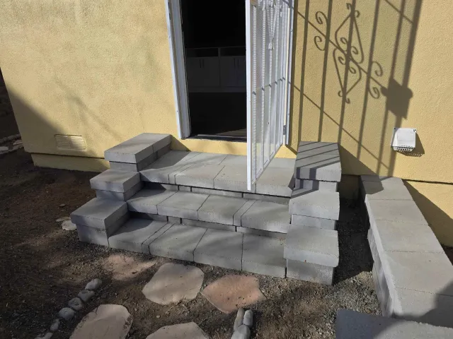 a view of backyard with wooden fence
