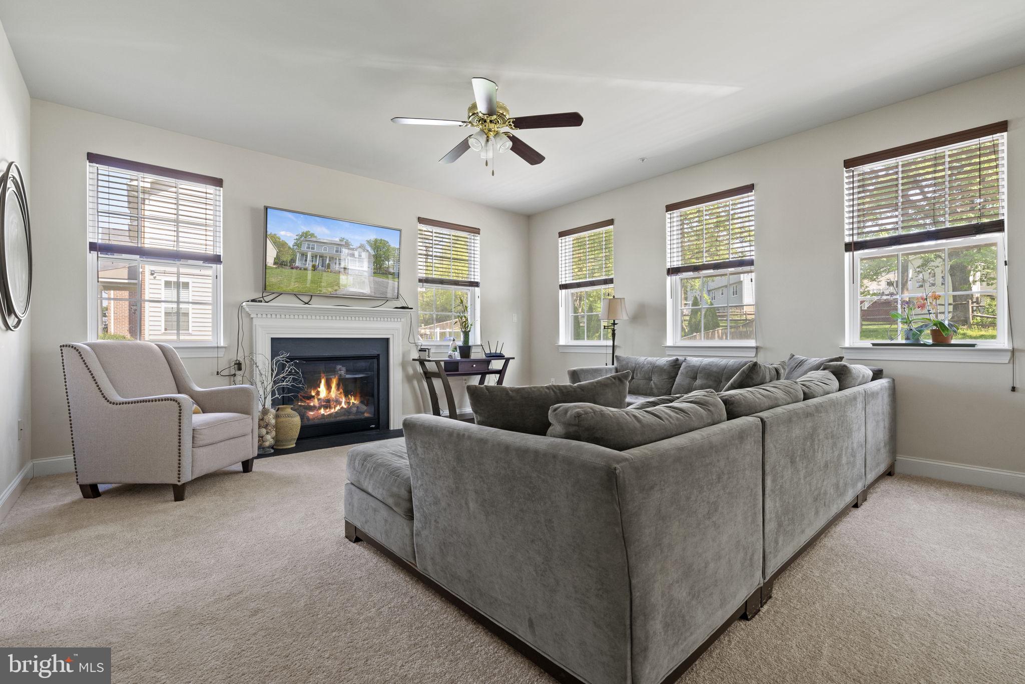 10490 Stansfield Road Laurel, MD 20723 - Photo 7 of 36 Sun filled Living room w/cozy fireplace!