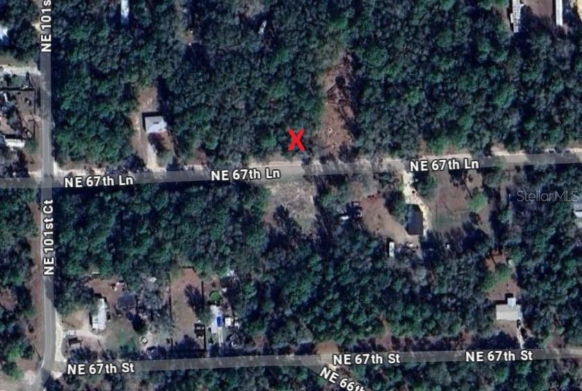 0 Northeast 67th Lane Bronson, FL 32621 - Photo 1 of 1 a view of a city with lush green forest