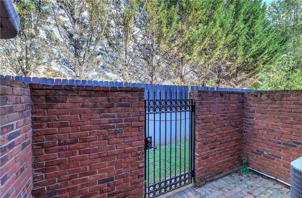 618 Manor Way Cartersville, GA 30120 - Photo 27 of 35 a brick building with a trees in the background