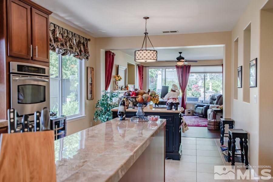 14070 Tagor Drive Reno, NV 89521 - Photo 7 of 24 a view of a dining room and livingroom