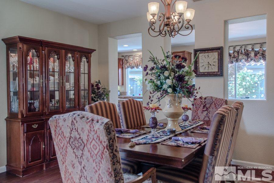 14070 Tagor Drive Reno, NV 89521 - Photo 8 of 24 a view of a dining room with furniture window and wooden floor