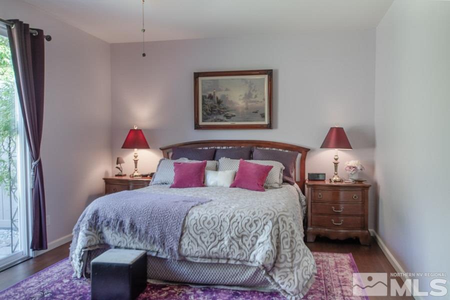 14070 Tagor Drive Reno, NV 89521 - Photo 9 of 24 a bedroom with a bed and wooden floor