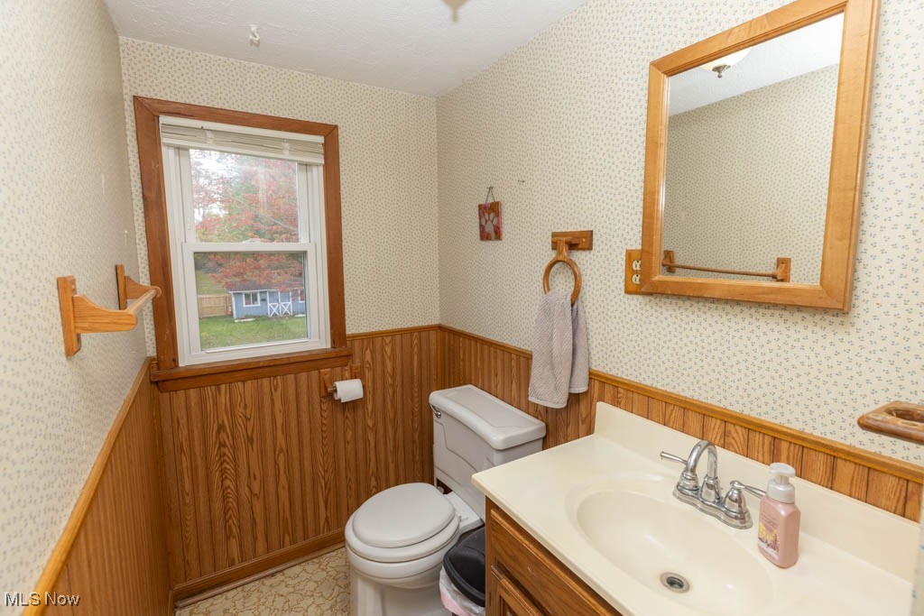1085 Novak Road Grafton, OH 44044 - Photo 28 of 41 Half bath featuring vanity and wallpapered walls