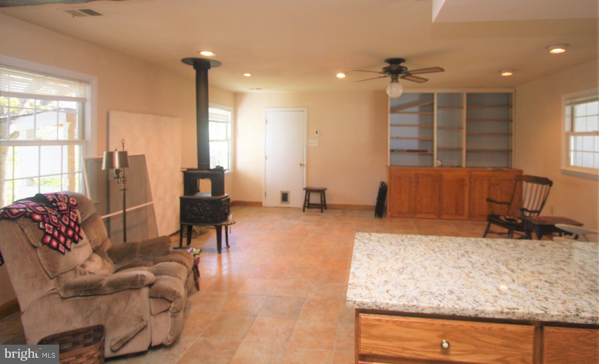 5001 West Running Brook Road Columbia, MD 21044 - Photo 4 of 26 Radiant Heated Tiles and Wood Stove