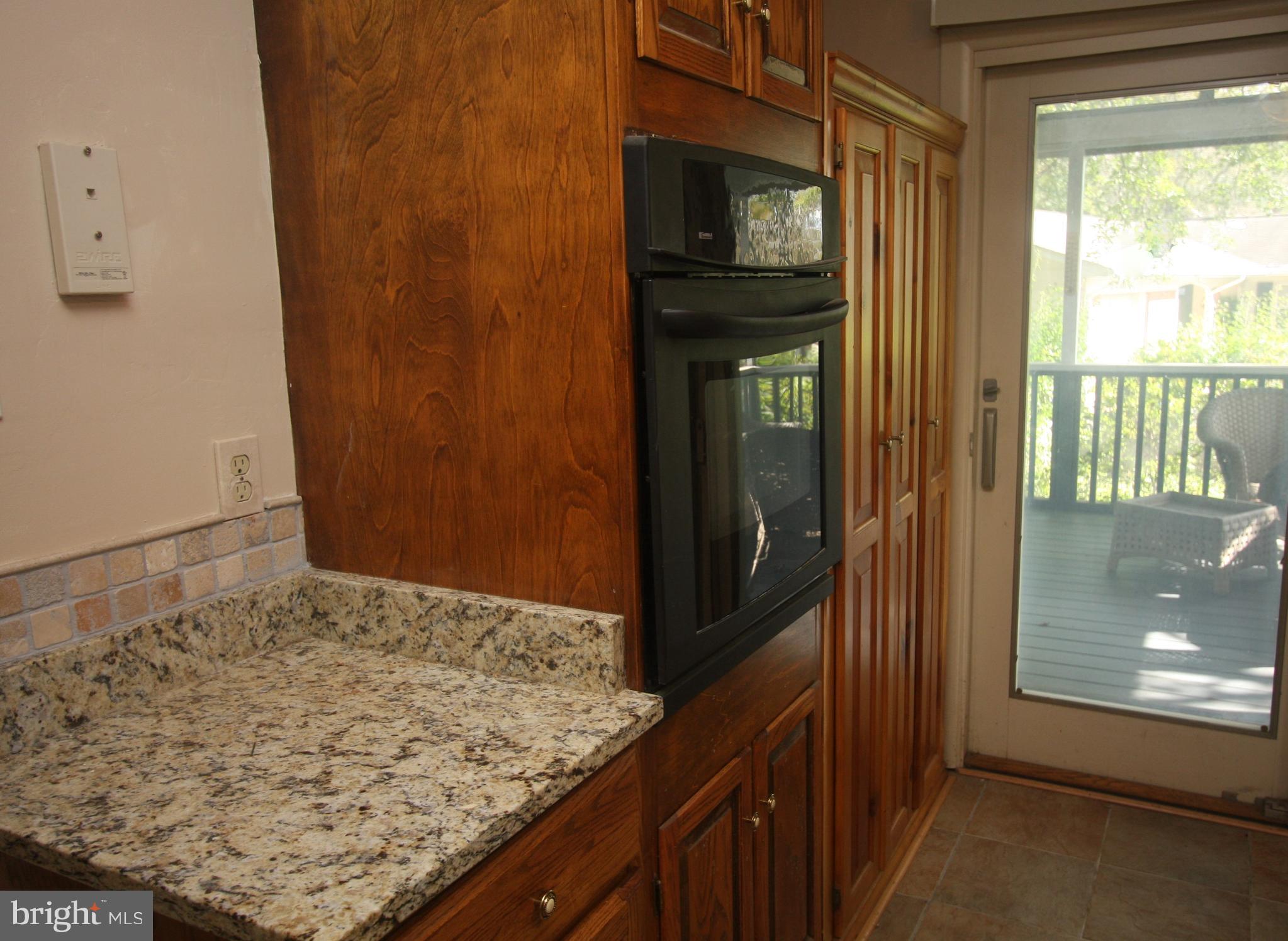 5001 West Running Brook Road Columbia, MD 21044 - Photo 7 of 26 Sliding Door to Screened Porch